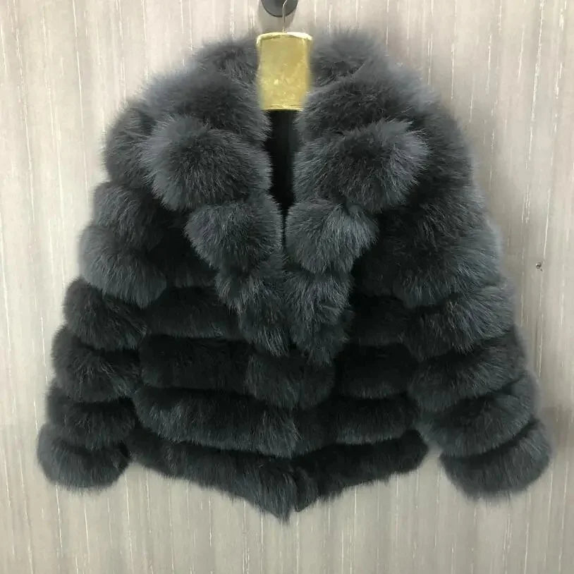 Lady's fashionable warm natural fur coat with a collar for warmth, luxurious high street outerwear