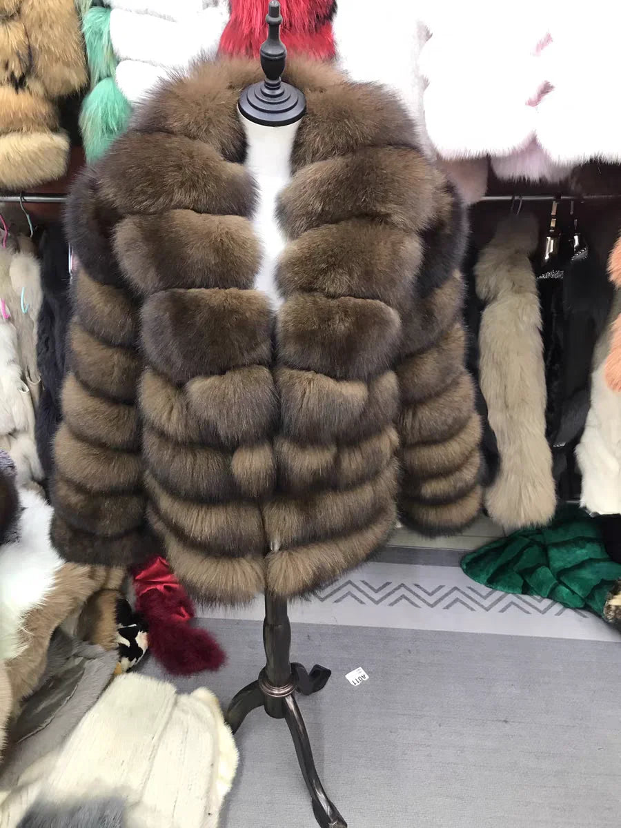 Lady's fashionable warm natural fur coat with a collar for warmth, luxurious high street outerwear