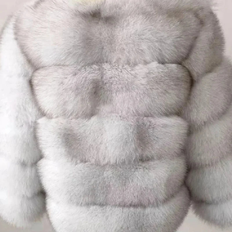 Lady's fashionable warm natural fur coat with a collar for warmth, luxurious high street outerwear