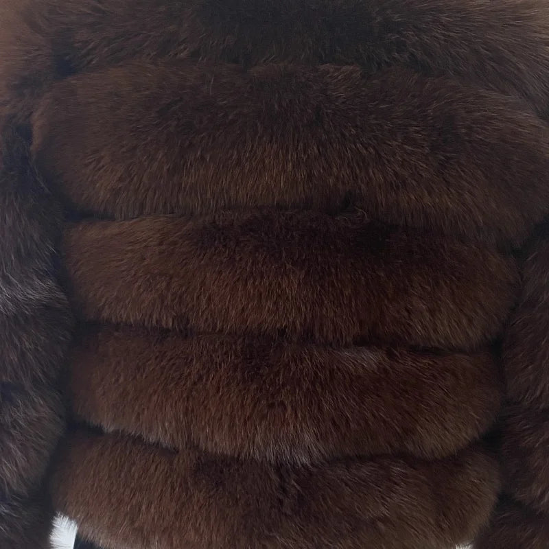 Lady's fashionable warm natural fur coat with a collar for warmth, luxurious high street outerwear