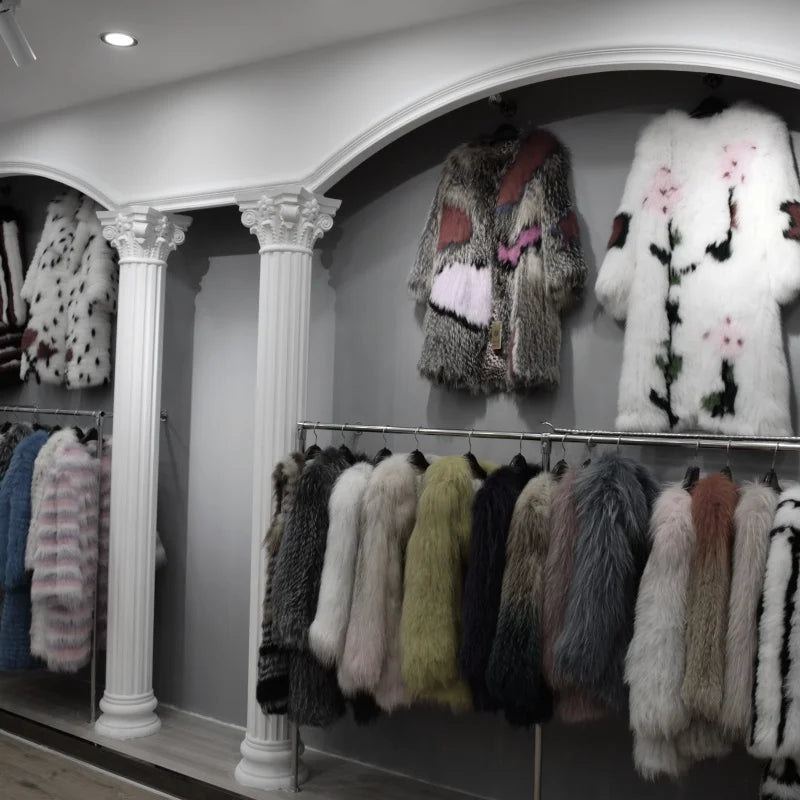 Lady's fashionable warm natural fur coat with a collar for warmth, luxurious high street outerwear