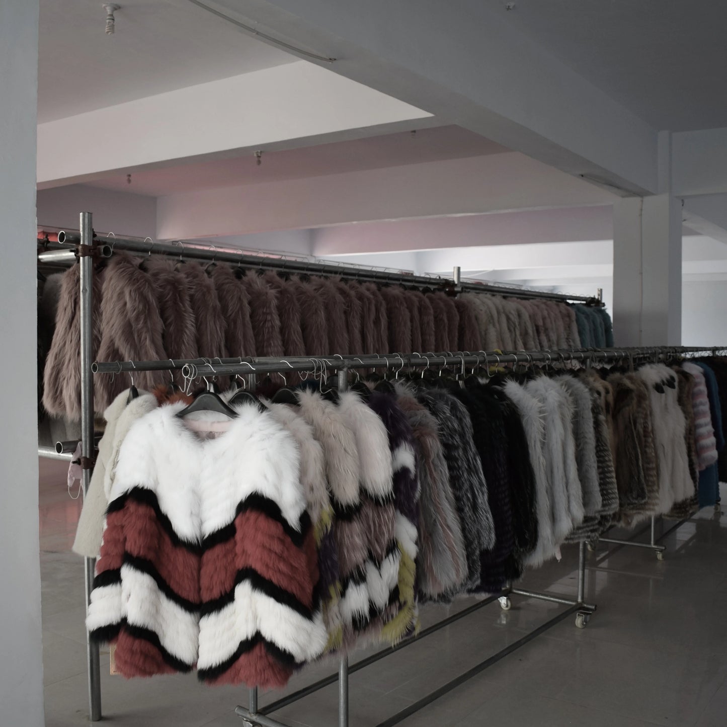 Lady's fashionable warm natural fur coat with a collar for warmth, luxurious high street outerwear